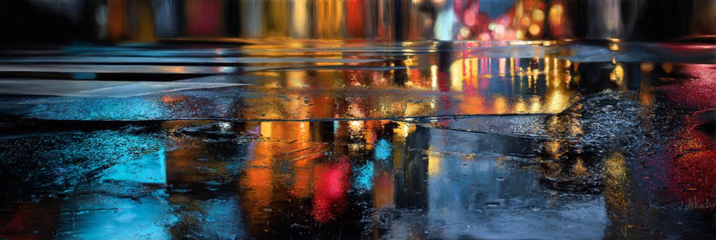 Colorful reflections of city lights on wet pavement, with streaks of blue, orange, red, and yellow blending into abstract patterns.